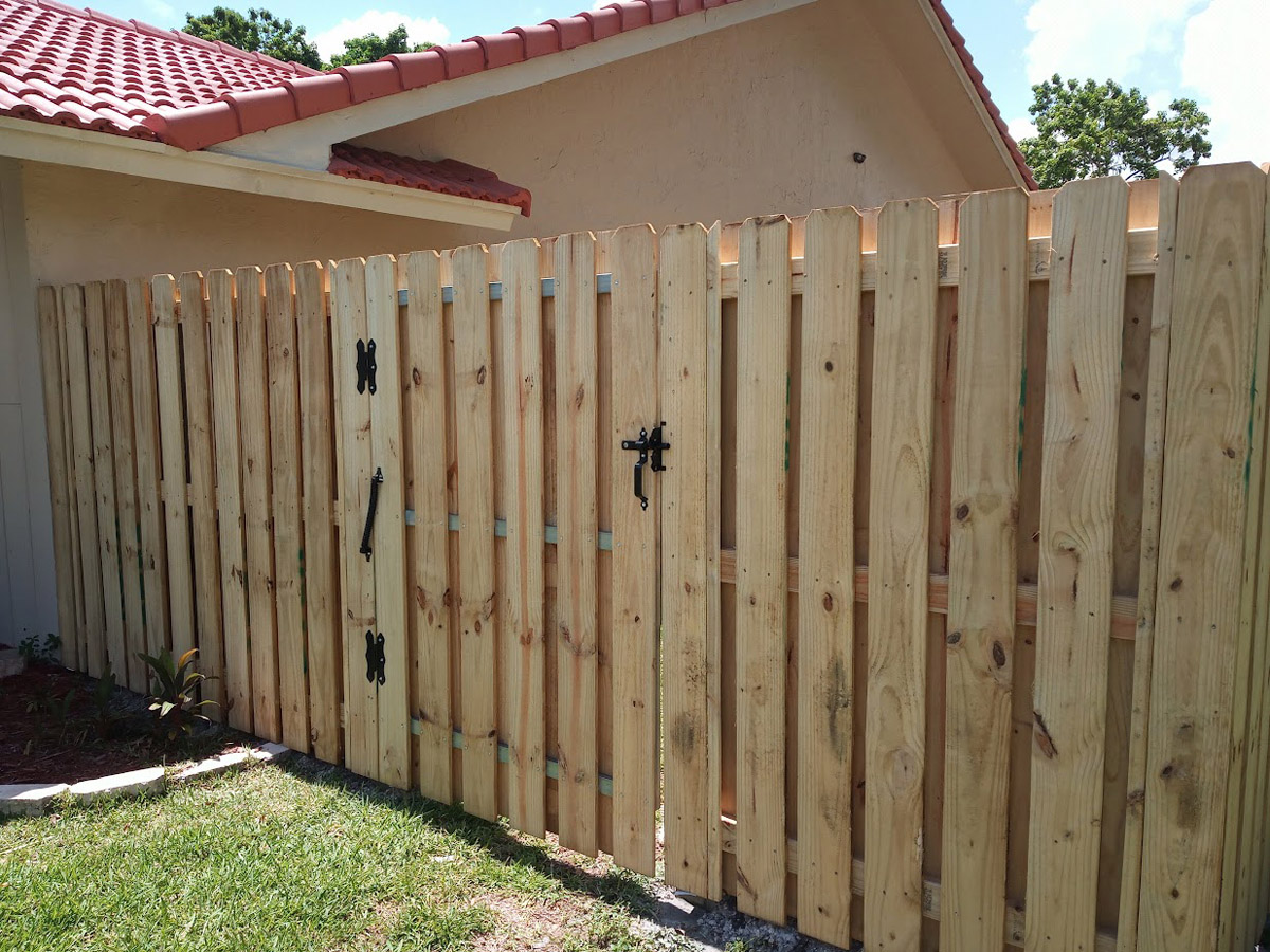Wood fence construction job Wooden Gate - Part of The Fence Installation - Job in Broward County